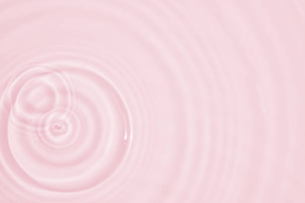 istock Abstract transparent water shadow surface texture natural ripple on pink background 1831517238