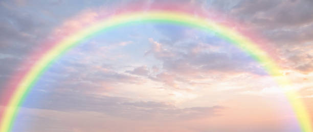 istock Beautiful rainbow with clouds and blue sky 1831520386