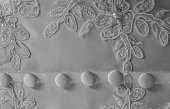 Black and white photo of section of old wedding dress