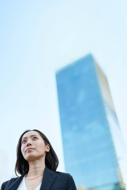 istock Business woman looking up at the sky 1831520882