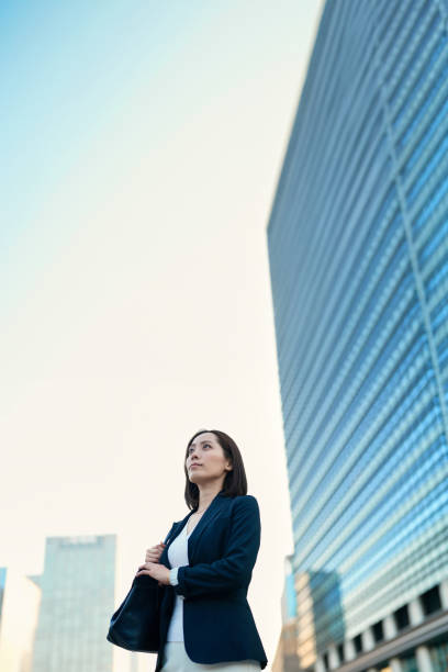 istock Business woman looking up at the sky 1831521618