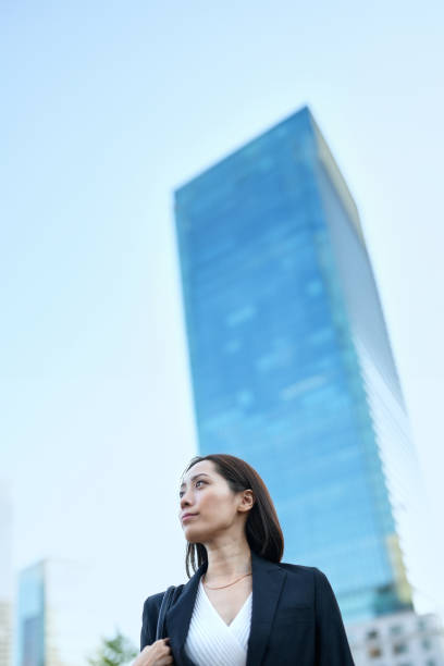istock Business woman looking up at the sky 1831521900