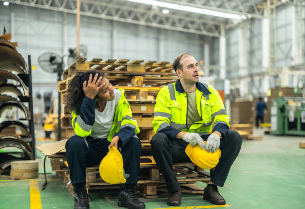 istock Cardboard workers chat, share ideas during breaks, foster togetherness, create positive workspace. 1831538269