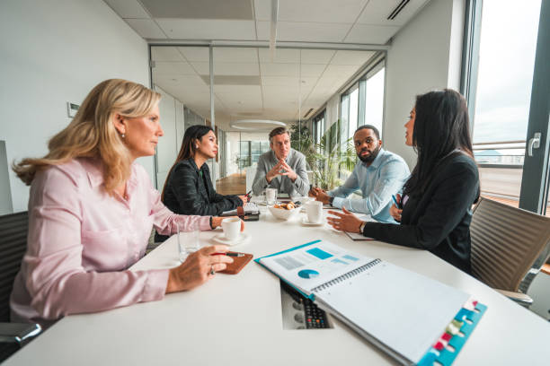 istock Mixed Mid Adult Multi-Ethnic Strategy Crew in a Meeting 1831539842