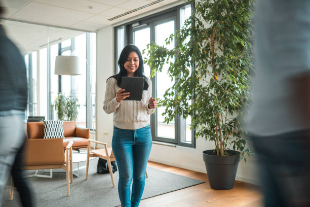 istock Successful Hispanic Female Entrepreneur  in Office Lounge 1831540899