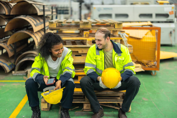 istock Cardboard workers chat, share ideas during breaks, foster togetherness, create positive workspace. 1831548334