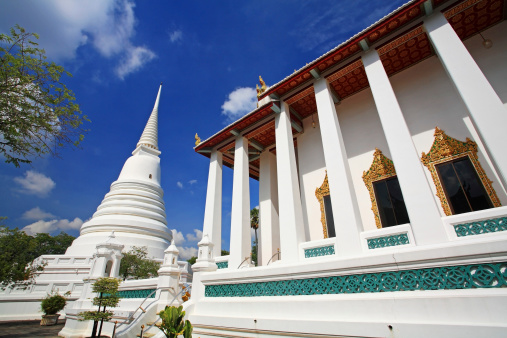 White pagoda against blue sky at wat Chalerm Prakiat in Nonthaburi, Thailand