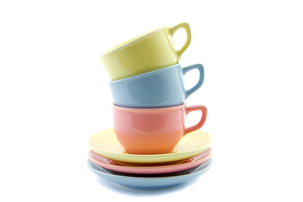 istock stacked tea cups in yellow, blue and pink 183157230