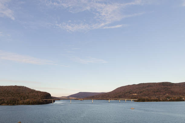 istock Colorful Autumn Trees on Mountains Connected by a Bridge Overlooking Water in Chattanooga, Tennessee During Thanksgiving Week in the Fall of 2023 1831576846