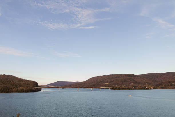 istock Colorful Autumn Trees on Mountains Connected by a Bridge Overlooking Water in Chattanooga, Tennessee During Thanksgiving Week in the Fall of 2023 1831576853