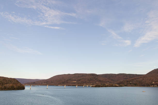 istock Colorful Autumn Trees on Mountains Connected by a Bridge Overlooking Water in Chattanooga, Tennessee During Thanksgiving Week in the Fall of 2023 1831576855