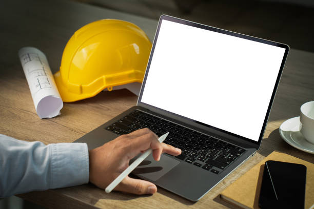 istock Freelancer typing on laptop Laptop with blank screen on table. Workspace background  copy space screen for your advertising text message 1831581524