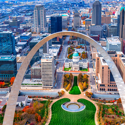 Aerial view of the downtown district of St. Louis, Missouri with the Gateway Arch in the foreground shot via helicopter from an altitude of about 500 feet.