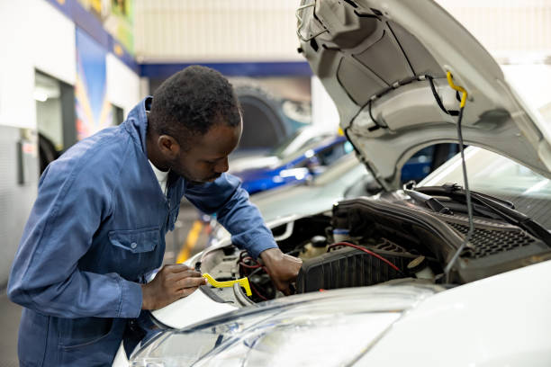 istock Mechanic fixing a car while working at an auto repair shop 1831594871