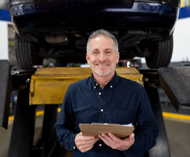istock Happy business owner working at a garage 1831595385