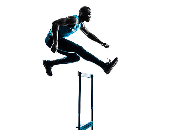 man hurdler runner silhouette one african man hurdler running in silhouette studio on white background hurdling track event stock pictures, royalty-free photos & images