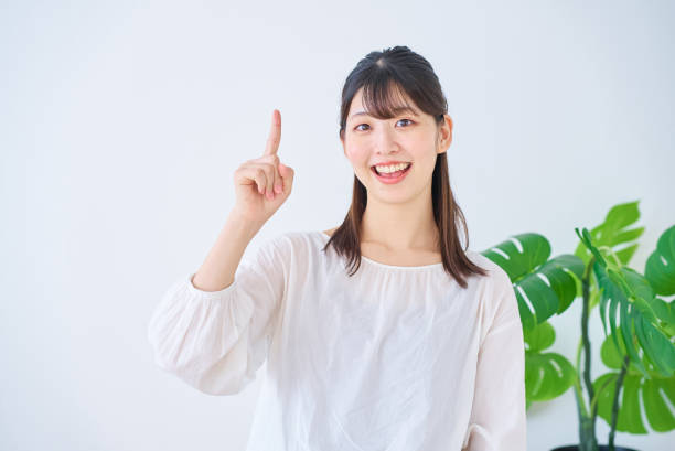 istock A young woman posing with her index finger raised 1831629091