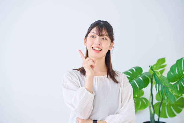 istock A young woman posing with her index finger raised 1831633341