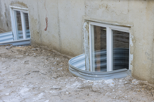 Window well will be installed in basement of new house under construction
