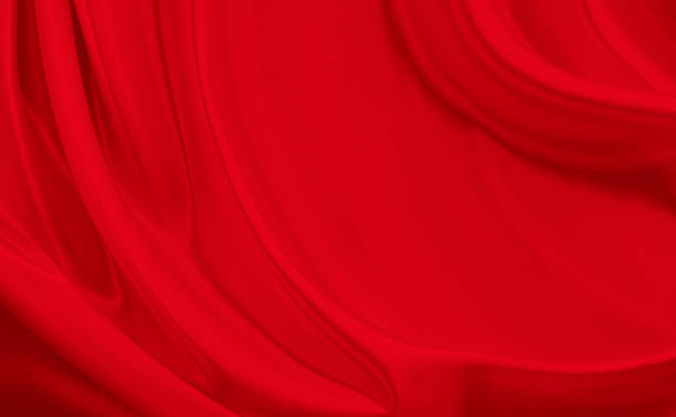 istock Black red satin dark fabric texture luxurious shiny that is abstract silk cloth background with patterns soft waves blur beautiful. 1831647968