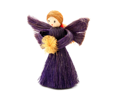Christmas Angel tree decoration made from straw, isolated on a white background
