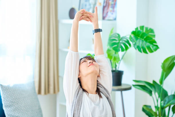 istock A young woman taking a deep breath in a casual space 1831673821