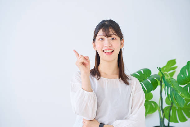istock A young woman posing with her index finger raised 1831677546