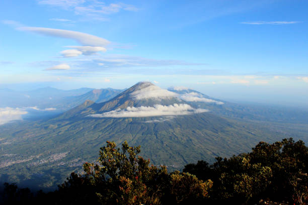 istock beautiful sindoro mountain with blue sky and cloud, in java indonesia, nature landscape photo background wallpaper 1831679108