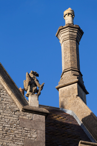 Architectural detail on a Victorian  manor house griffin and chimney stack