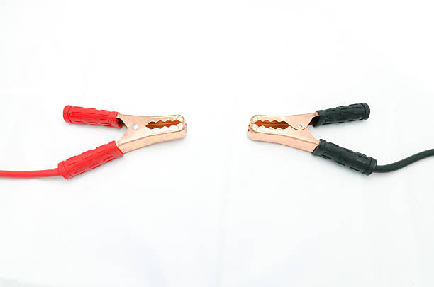 Jumper cables for jump starting a car Jumper cables for jump starting a car jumper cable stock pictures, royalty-free photos & images