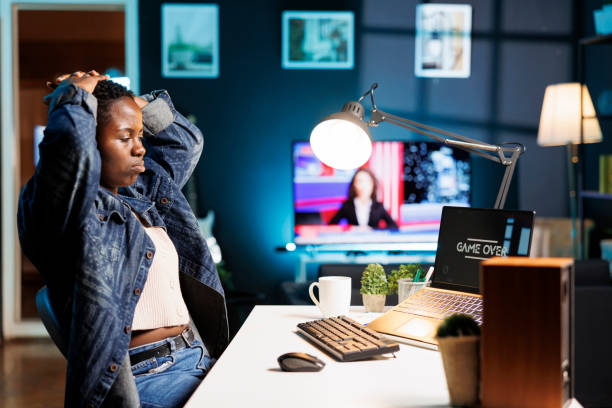 istock Upset gamer looking at laptop screen 1831735533