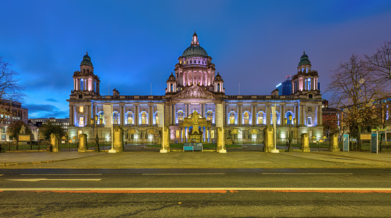 The imposing Belfast City Hall illuminated at dawn
