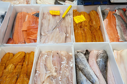 Different kinds of fish fillet for sale at a market