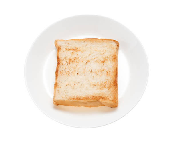 istock Slices toast bread in dish on white background 1831735789