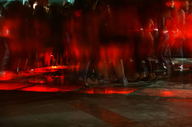 istock Nightclub dance crowd in motion 183176590