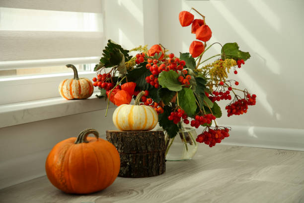 istock Beautiful autumn composition with different pumpkins indoors 1831770724