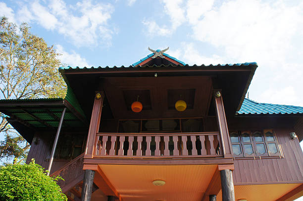 Thai blockhouse on the blue sky Thai blockhouse on the blue sky in the country of thailand fairy door fairy tale antique stock pictures, royalty-free photos & images