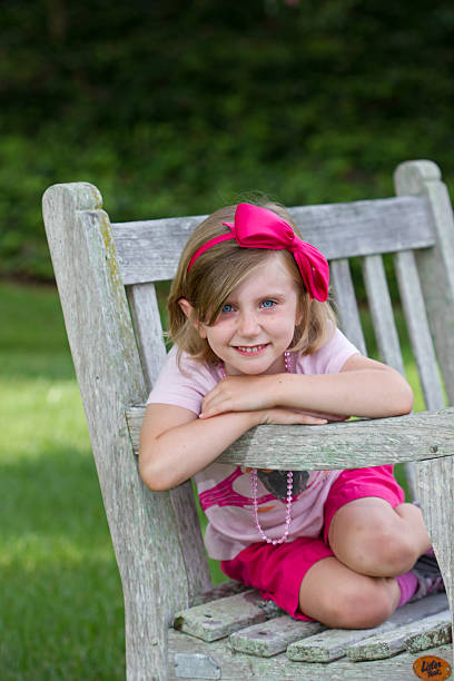 istock Girl Posing On Park Bench 183177998