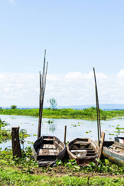 istock fisherman boat at a shore,Sakon Nahkon,Thailand. 183181243