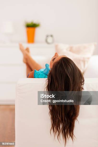 Woman With Long Hair Relaxing On The Couch Stock Photo - Download Image Now - Adult, Adults Only, At The Edge Of