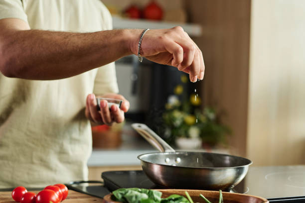 istock Man Salting Food 1831820686
