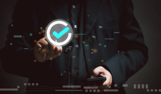 istock Businessman use mobile for list quality assurance and service. Test for evaluating the quality of products, organizations, manufacturing industries and online services. Doing questionnaires satisfaction. 1831859021