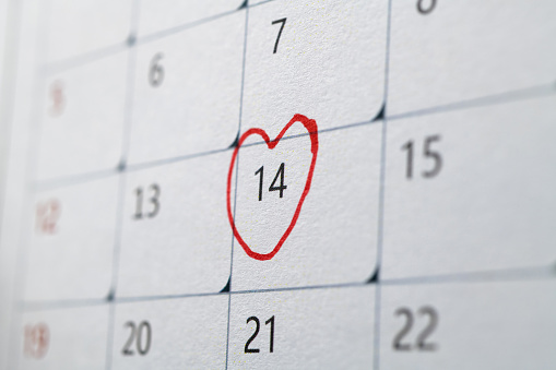 February calendar marked with heart shape.