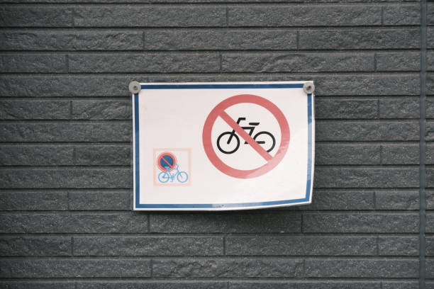istock Old no bicycles sign on a gray wall 1831877044