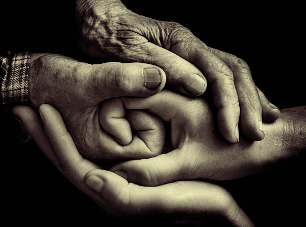 istock handshake of the generations 183188765