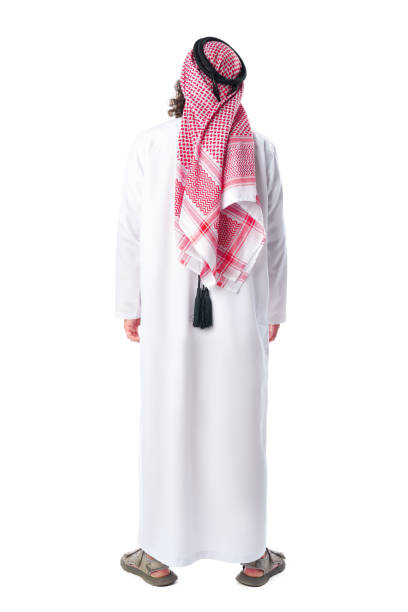 istock Back view of an Man man in thobe standing on white isolated background 1831887675