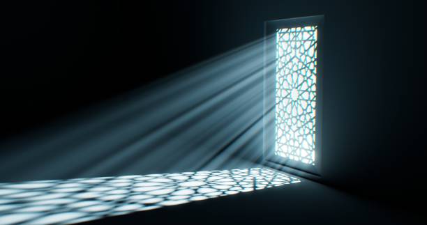 istock Light bathes the floor as it emanates from a window embellished with a floral design. 1831906985
