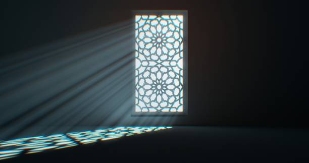 istock A window featuring floral ornamentation lets in light that falls gracefully onto the floor. 1831907506