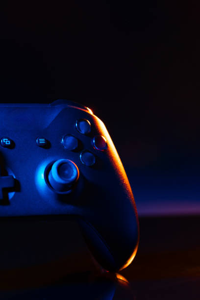istock Gaming joystick on black background in neon light 1831922498