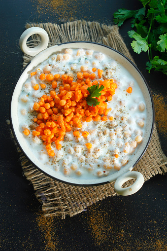 Boondi Raita is a popular and refreshing Indian side dish made with yogurt and small, crispy fried gram flour balls called boondi.
